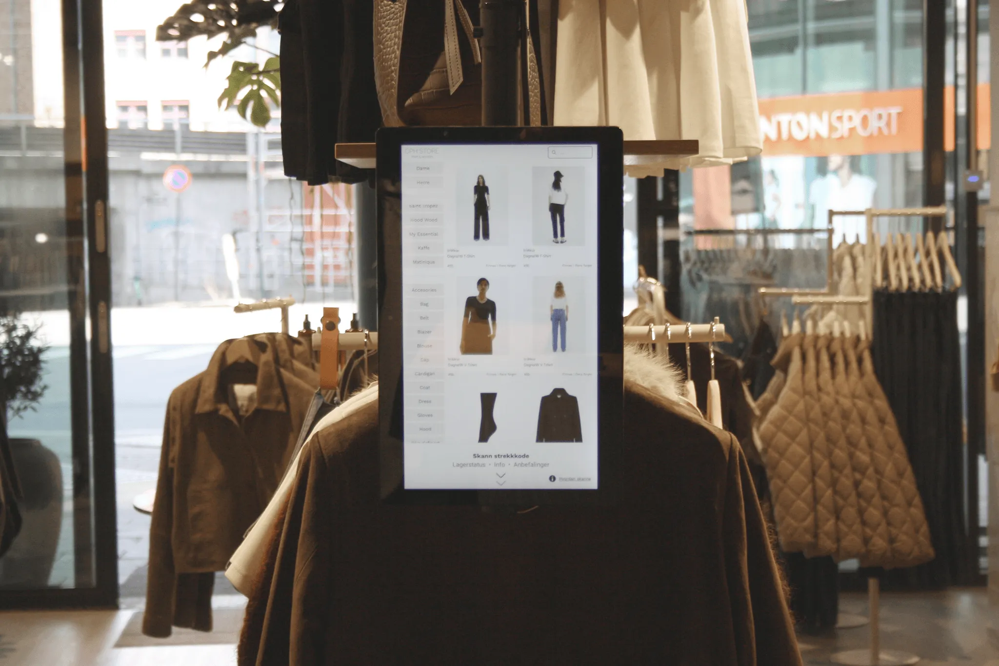 Woopz assistant screen next to clothing on the sales floor